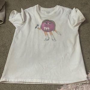 white mnm shirt